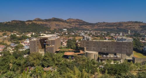 an aerial view of a city with buildings and mountains at Radisson Resort and Spa Lonavala in Lonavala