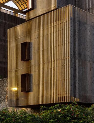 a building with three windows on the side of it at Radisson Resort and Spa Lonavala in Lonavala