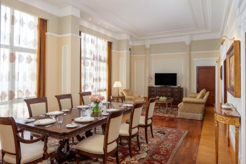 a dining room with a table and chairs at The Regency Hotel Kuwait in Kuwait