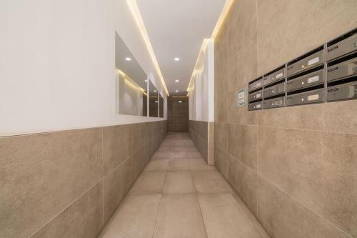 a hallway of a building with at La Caracola - Espíritu libre A/A in El Altet