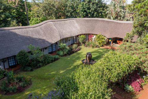 an overhead view of a house with a garden at Country Rose in Hluhluwe