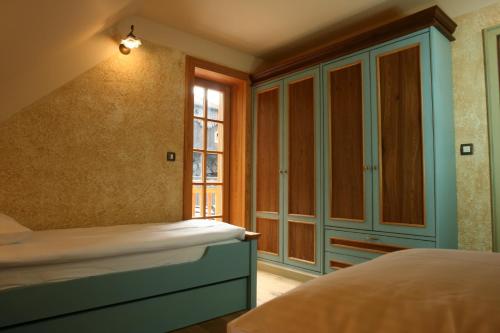 a bedroom with a bed and a window at Villa Les with Hot tub & Sauna in Brežice