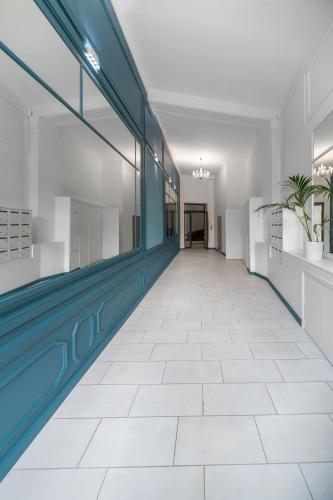 an empty hallway with a pool in a building at Le Wilson - Appartement design - Hyper centre in Vichy