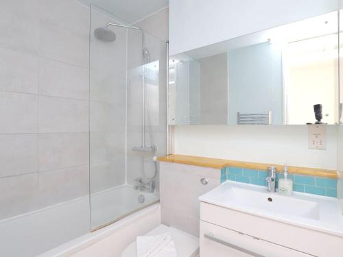 a white bathroom with a shower and a sink at Pass the Keys Headington 4BR Home Parking and Garden Oxford in Oxford