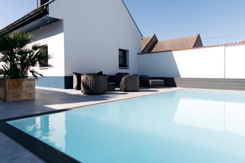 a swimming pool in the middle of a house at KRACHER Landhaus No. 2 in Illmitz