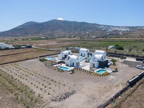 an aerial view of a house in a field at Oia Kissiri - Private Pool Villas in Oia