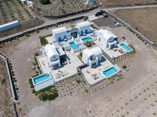 an overhead view of a house with a pool at Oia Kissiri - Private Pool Villas in Oia