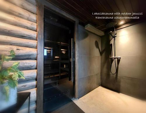 a hallway of a house with a wooden wall at LakeLodge Kiehinen & Igloos in Rovaniemi