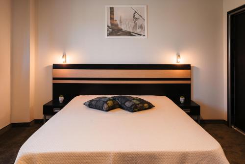 Postel nebo postele na pokoji v ubytování Hotel Ihtiman