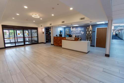 a lobby of a store with a counter at Hampton Inn & Suites Denton in Denton