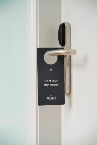 a door tag that reads sent out my room at The Flint Hotel in Belfast