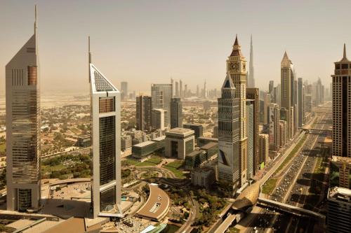 an aerial view of a city with tall buildings at Waldorf Astoria Dubai International Financial Centre in Dubai