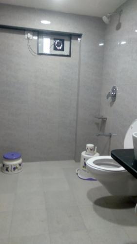 a bathroom with a shower and a toilet in it at Abu Inn, Mount Abu - The Luxury Boutique Stay in Mount Ābu