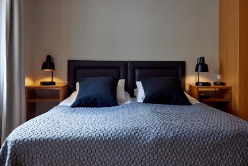 Postel nebo postele na pokoji v ubytování Hotel Frón