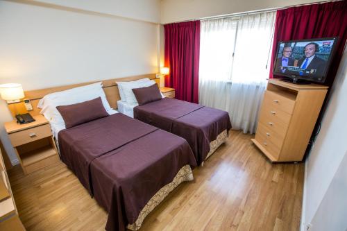 Кровать или кровати в номере Callao Suites Recoleta