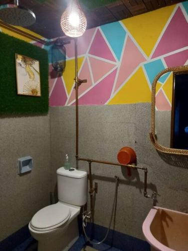 a bathroom with a toilet and a sink at 3 Bedrooms Villa with Private Pool in Port Dickson