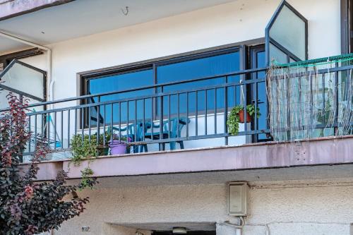 a balcony of a house with plants on it at Studio in Gastouni in Gastoúni