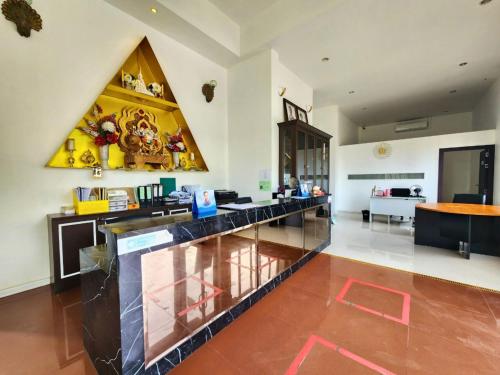 a large room with a counter in a room at AURA Park Resort in Ban Thung Sam Sao