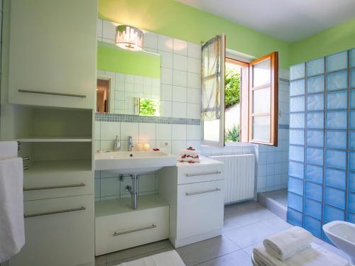 a bathroom with a sink and a mirror at Villa Lakecomo - Ritrovo in Menaggio