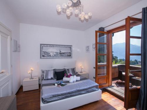 En eller flere senge i et værelse på Villa Lakecomo - Ritrovo