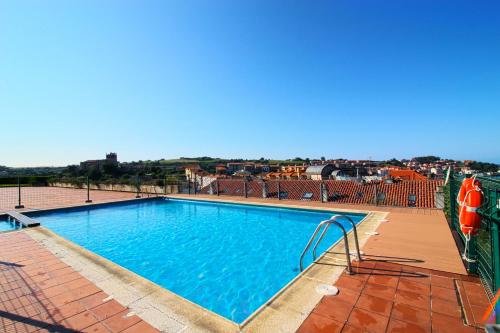a large swimming pool on top of a building at El Rincón del Mar in San Vicente de la Barquera
