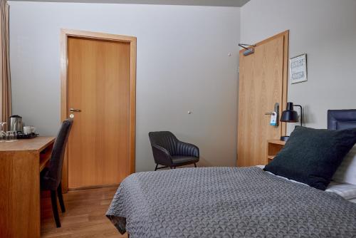Postel nebo postele na pokoji v ubytování Hotel Frón