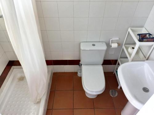 a bathroom with a toilet and a sink at Estudio Regency Alcaidesa in La Alcaidesa