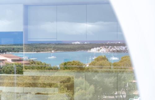 a view of a harbor with boats in the water at Portomar Apartments in Portocolom