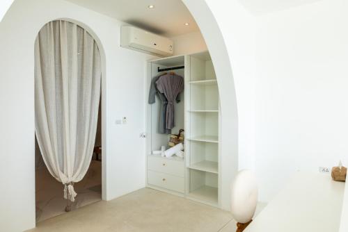 a dressing room with a mirror and a closet at 5House:A luxury beachfront villa on Samui 滨海5卧室别墅 in Hua Thanon Beach