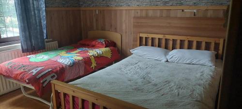 Кровать или кровати в номере RK Heritage Hotel
