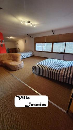 Katil atau katil-katil dalam bilik di Somptueuse Villa Jasmine