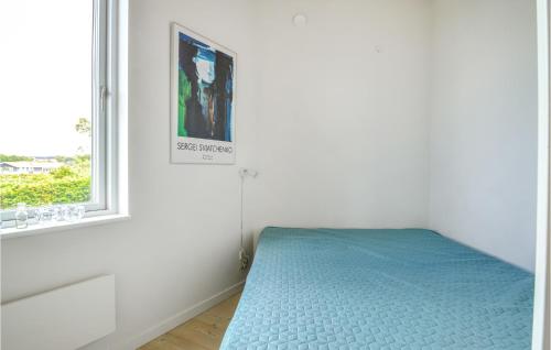 a white room with a bed and a window at Three-Bedroom Holiday Home In Farso in Farsø