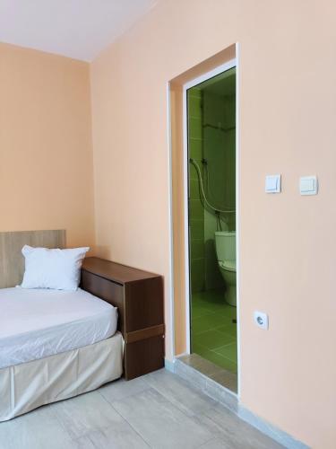 Postel nebo postele na pokoji v ubytování PLEVEN Rooms