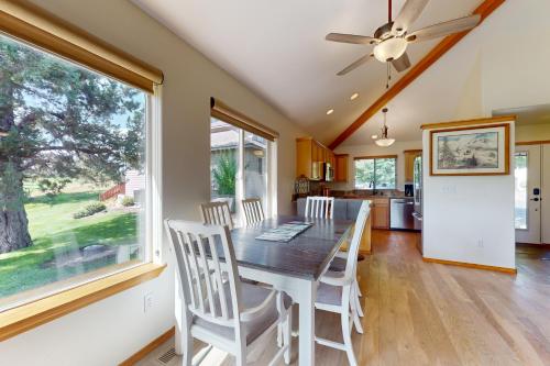 a dining room with a table and chairs and a window at The Golden Pheasant in Redmond
