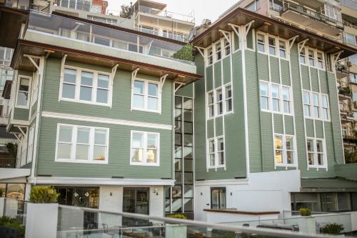 a green building in front of some buildings at Loop Hotel Bosphorus İstanbul in Istanbul