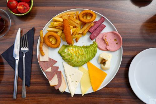 a plate with different types of food on a table at Loop Hotel Bosphorus İstanbul in Istanbul