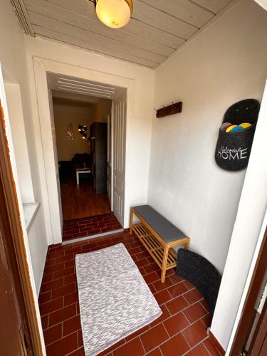 a hallway with a table and a bench in a room at Ferienwohnung Anna in Burgau