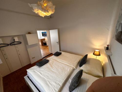 a bedroom with two beds with pillows on them at Ferienwohnung Anna in Burgau