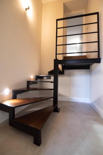 a room with a spiral staircase in a room at La Finestra Sul Vulcano in Roccamonfina