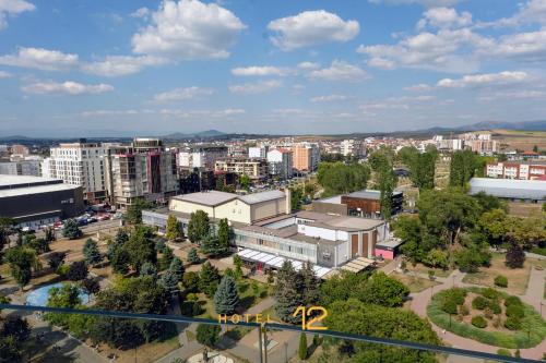 an aerial view of a city with buildings at HOTEL 12 in Gjakove