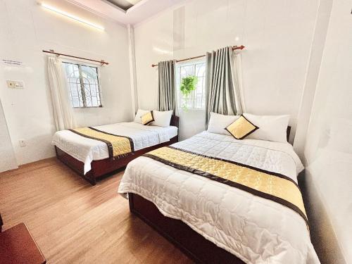 Giường trong phòng chung tại My Kim Hotel - Ngay Bến Ninh Kiều