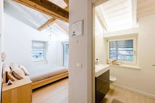 a bedroom with a bed and a bathroom at B&B Il Piccolo Principe in Bieno
