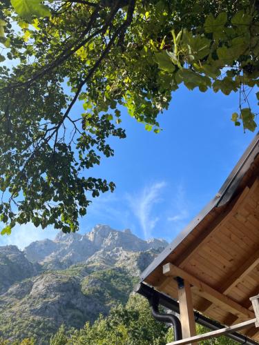 a view of the mountains from the porch of a house at Guesthouse Gezim Selimaj in Valbonë