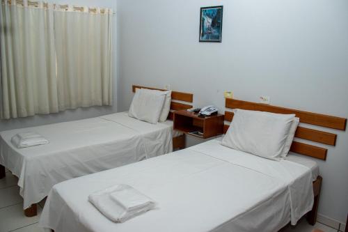 Ένα ή περισσότερα κρεβάτια σε δωμάτιο στο Inácios Hotel ltda