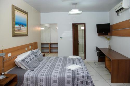 Ένα ή περισσότερα κρεβάτια σε δωμάτιο στο Inácios Hotel ltda