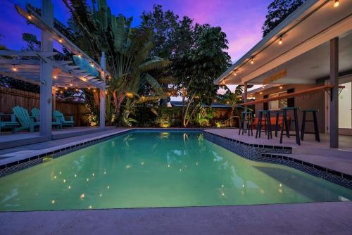a swimming pool in the backyard of a house at Heated Pool House: Beach 3Miles · Bar · BBQ & GYM! in Largo