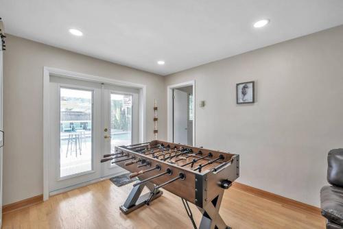 a living room with a large stove in the middle at Heated Pool House: Beach 3Miles · Bar · BBQ & GYM! in Largo
