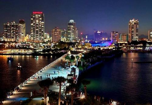 a view of a city at night with a river at Heated Pool House: Beach 3Miles · Bar · BBQ & GYM! in Largo