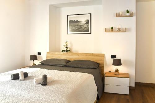 a bedroom with a bed with two towels on it at La Terrazza in Malesco