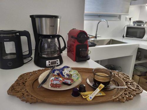 a kitchen counter with a tray of food and a blender at Stavros Residence in Mármara